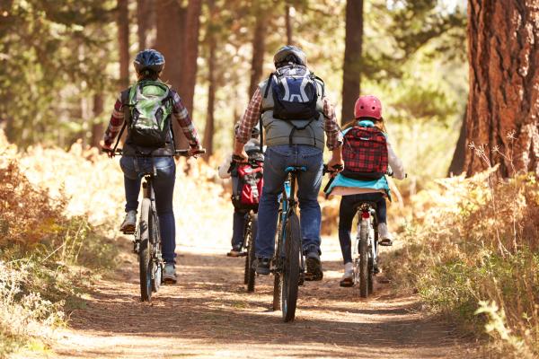 Family on bikes behind shutterstock 398303084